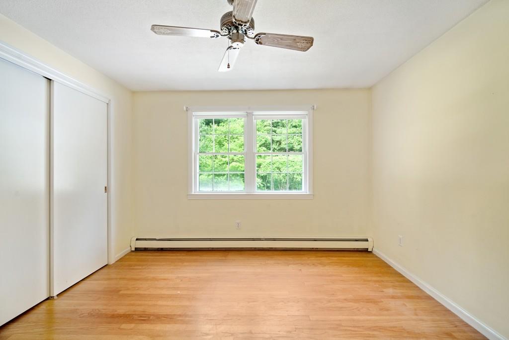 130 Senator Street Springfield, MA 01129 - Photo 23 of 35 wooden floor in an empty room with a window