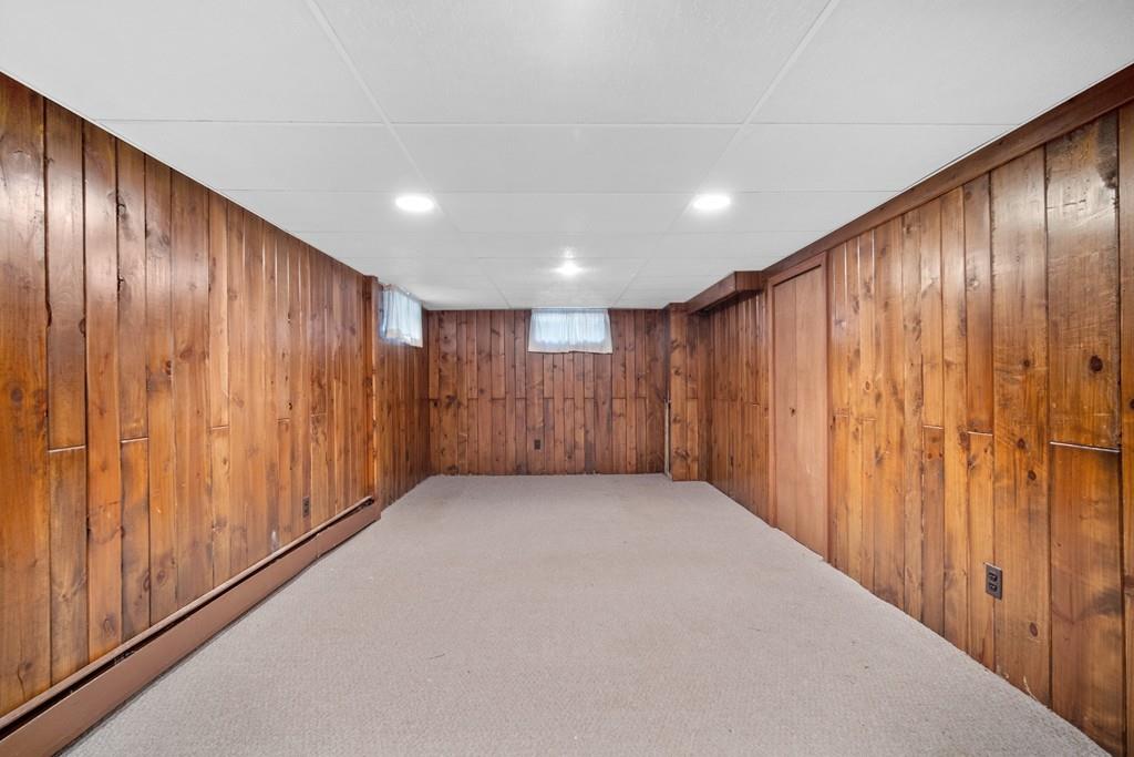 130 Senator Street Springfield, MA 01129 - Photo 29 of 35 a view of an empty room with wooden walls
