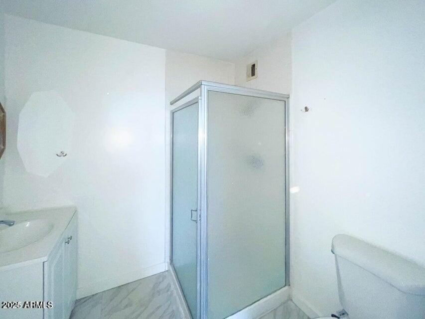6767 North 7th Street, Unit 227 Phoenix, AZ 85014 - Photo 8 of 11 a bathroom with a shower toilet and sink