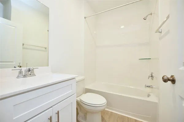 a bathroom with a sink a toilet and a bathtub