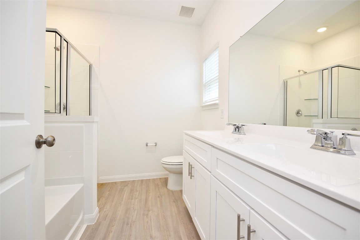 25473 Cilantro Drive Magnolia, TX 77355 - Photo 16 of 21 a bathroom with a sink a toilet and shower