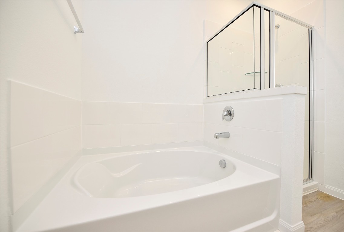 25473 Cilantro Drive Magnolia, TX 77355 - Photo 17 of 21 a white bath tub sitting next to a white wall
