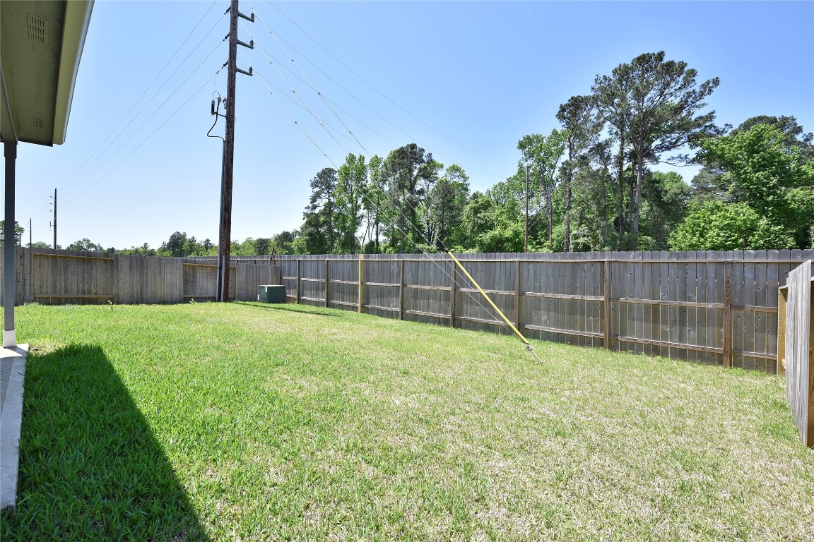 25473 Cilantro Drive Magnolia, TX 77355 - Photo 19 of 21 a view of a backyard with a play ground