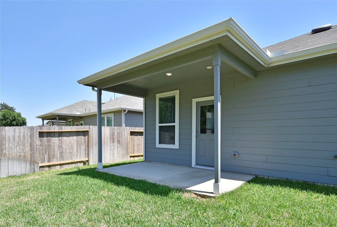 25473 Cilantro Drive Magnolia, TX 77355 - Photo 20 of 21 a backyard of a house with plants and a garden