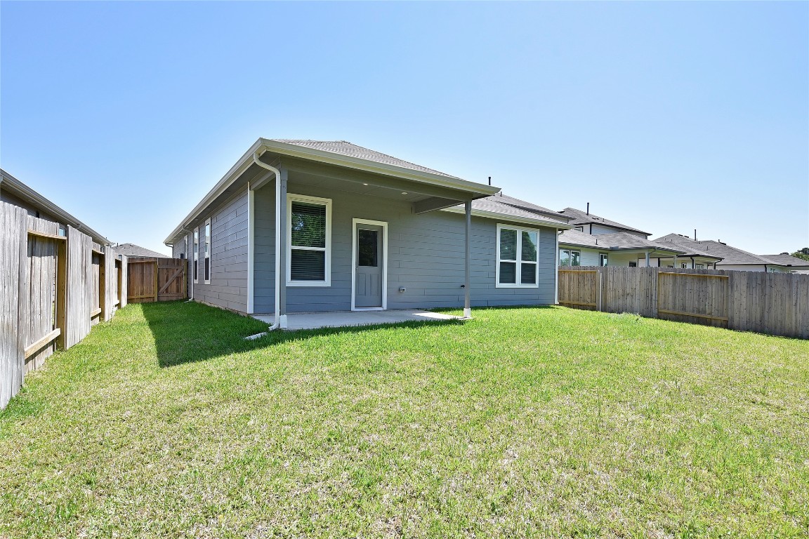 25473 Cilantro Drive Magnolia, TX 77355 - Photo 21 of 21 a house view with a garden space