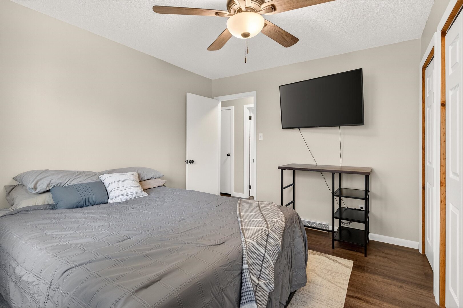 1136 4th Avenue North Clinton, IA 52732 - Photo 11 of 34 a bedroom with a bed and a flat screen tv