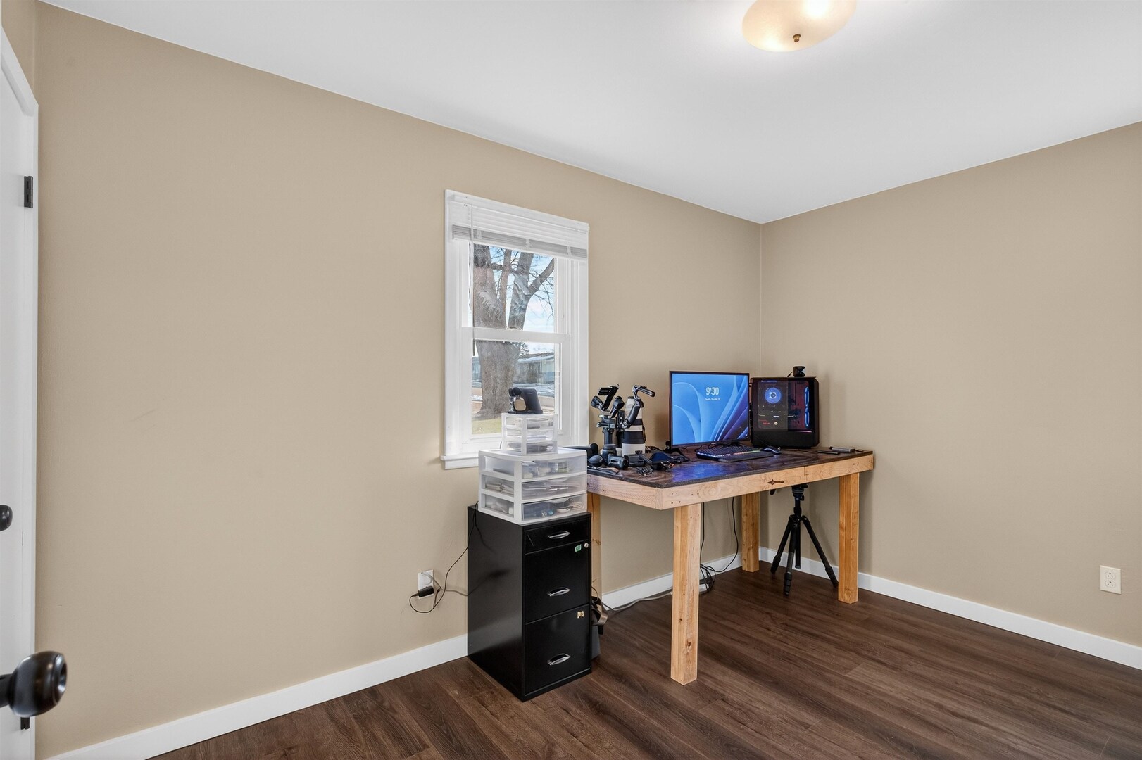 1136 4th Avenue North Clinton, IA 52732 - Photo 18 of 34 a view of a workspace with furniture and wooden floor