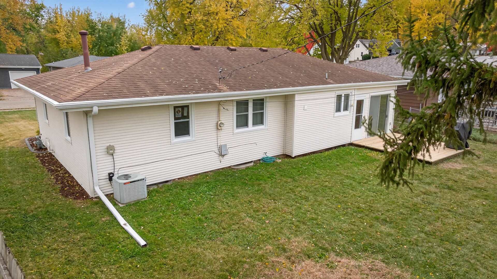 1136 4th Avenue North Clinton, IA 52732 - Photo 30 of 34 a white house that has tree in front of it
