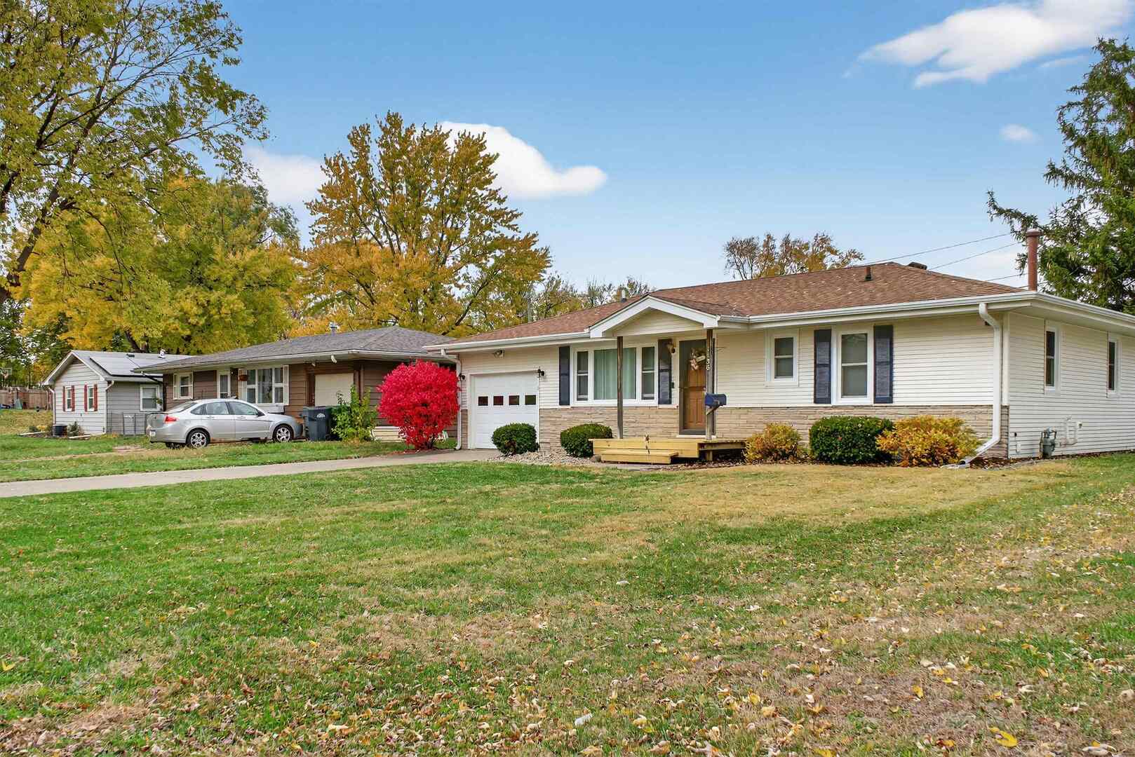 1136 4th Avenue North Clinton, IA 52732 - Photo 33 of 34 a front view of a house with a garden