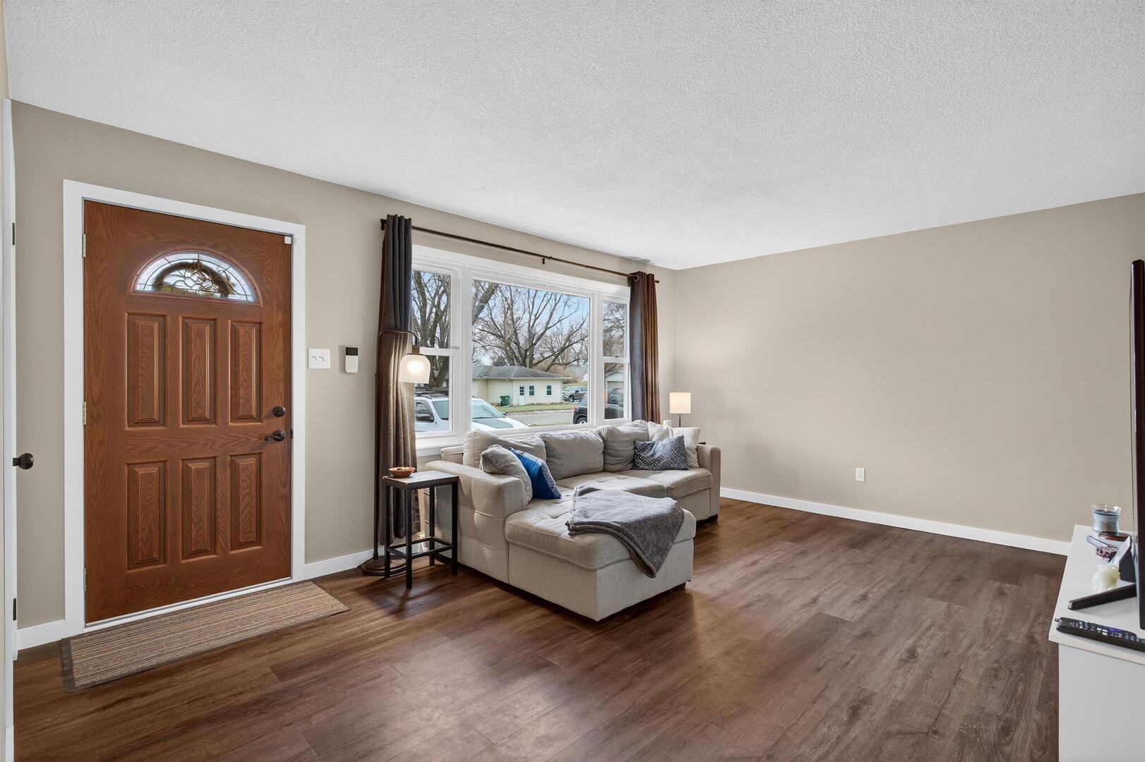 1136 4th Avenue North Clinton, IA 52732 - Photo 4 of 34 a living room with furniture and a wooden floor