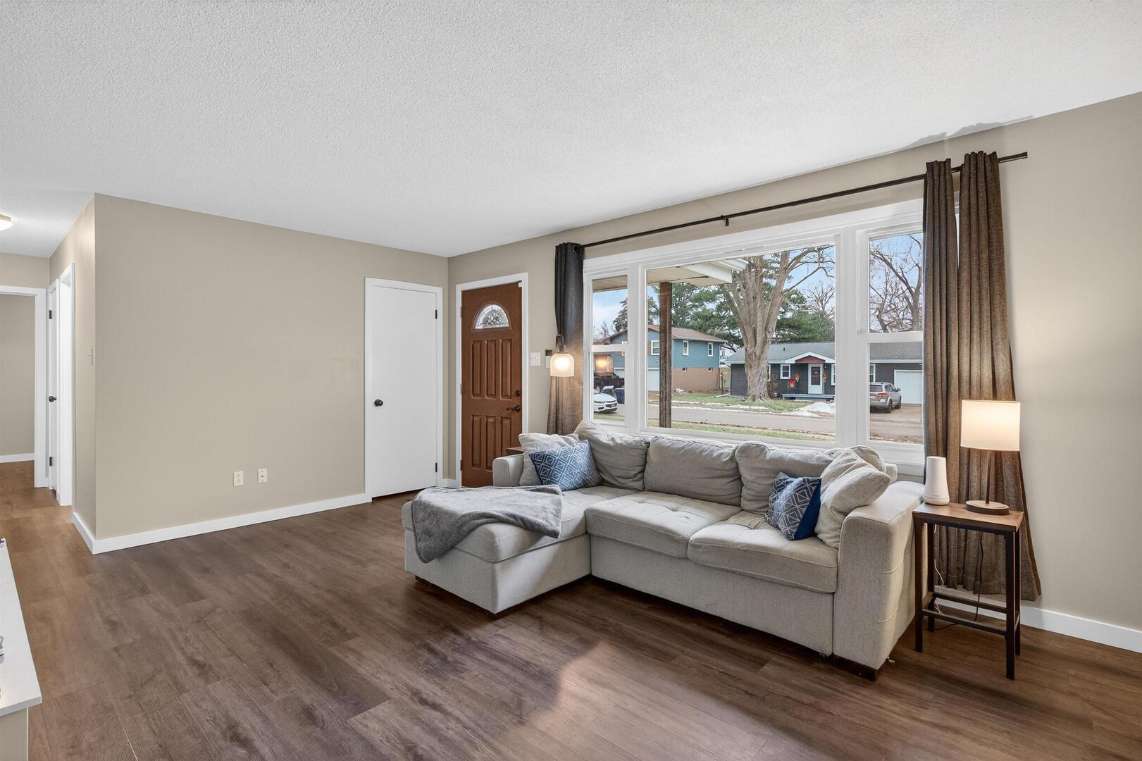 1136 4th Avenue North Clinton, IA 52732 - Photo 5 of 34 a living room with furniture and a large window