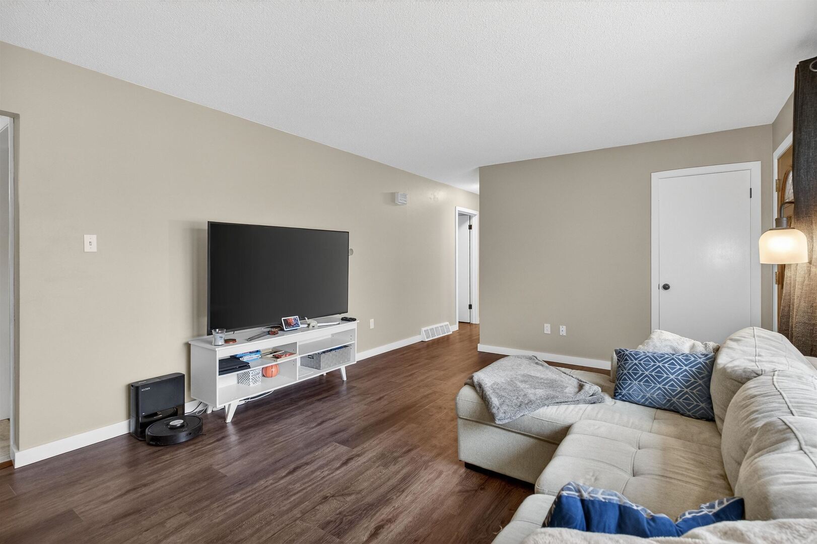 1136 4th Avenue North Clinton, IA 52732 - Photo 7 of 34 a living room with furniture and a flat screen tv