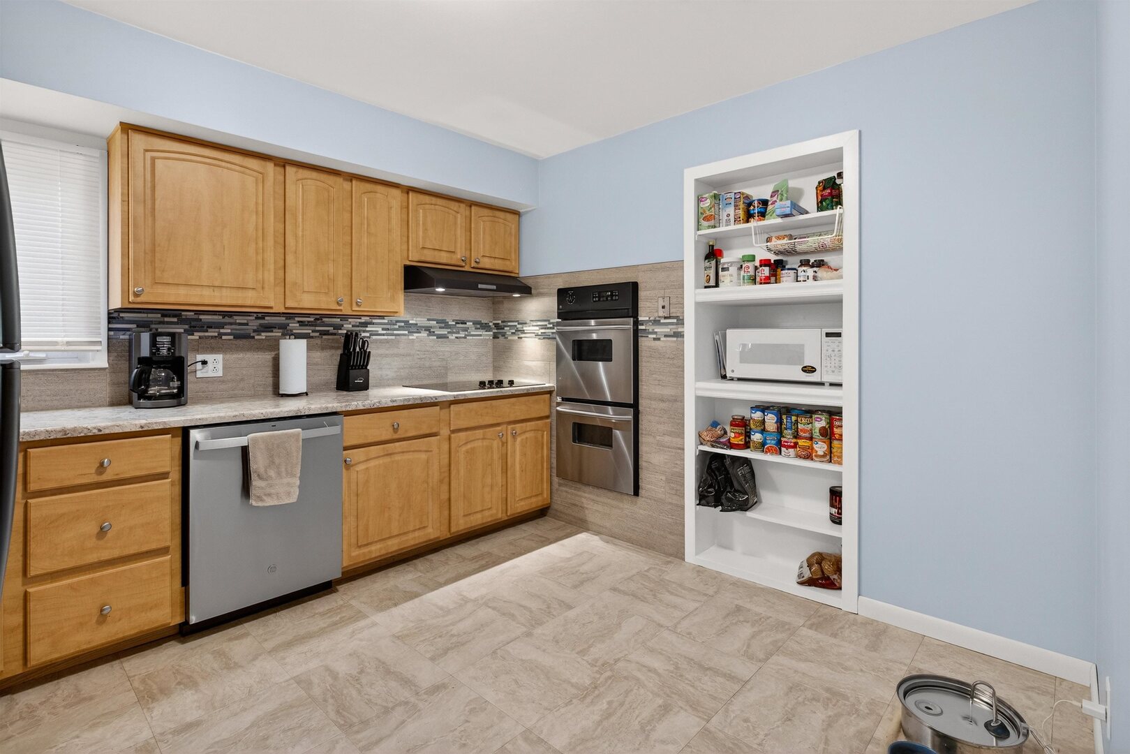 1136 4th Avenue North Clinton, IA 52732 - Photo 9 of 34 a kitchen with appliances cabinets and a sink