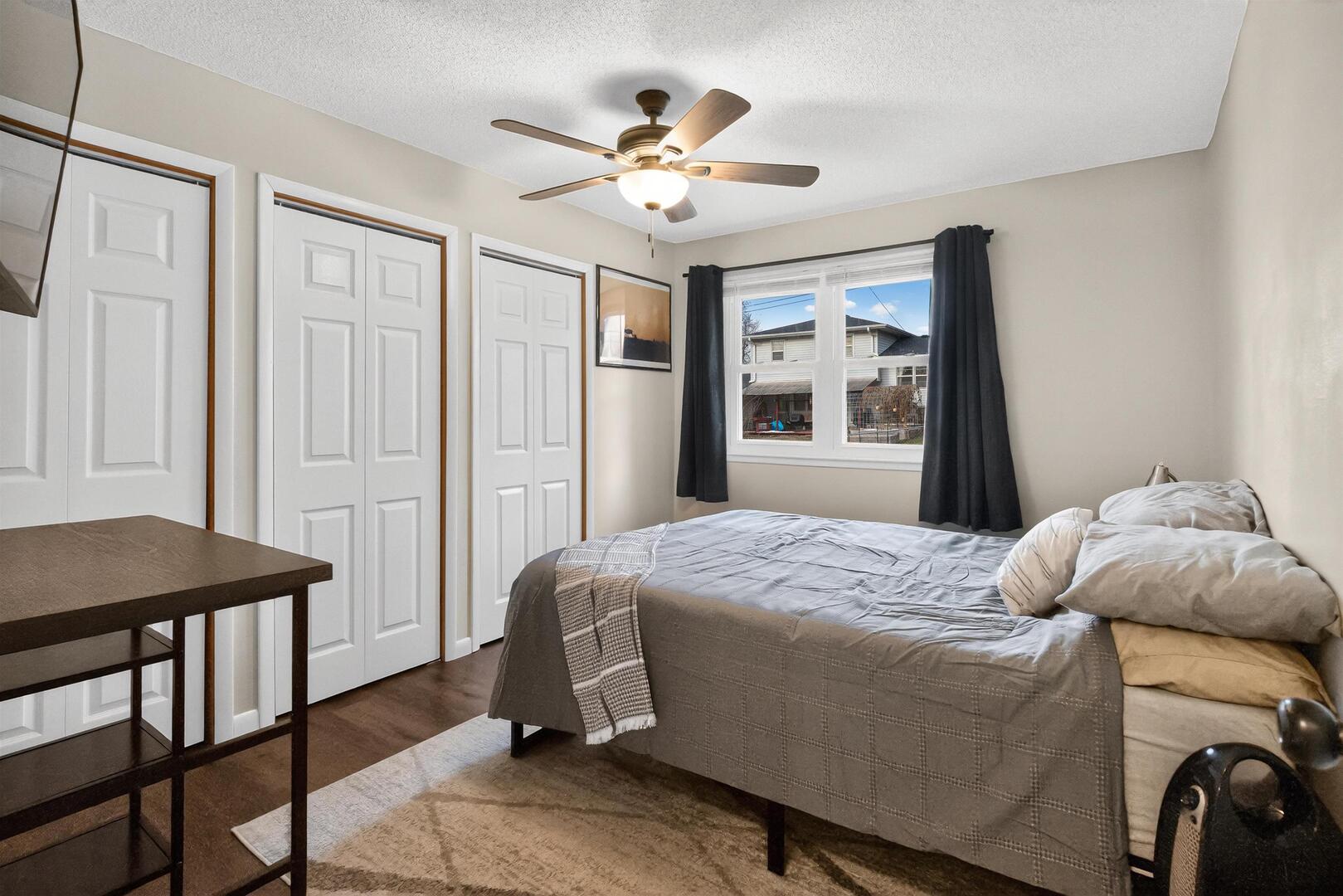 1136 4th Avenue North Clinton, IA 52732 - Photo 10 of 34 a bedroom with a bed and a chandelier