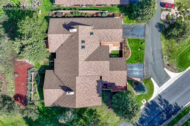 an aerial view of a house with a garden