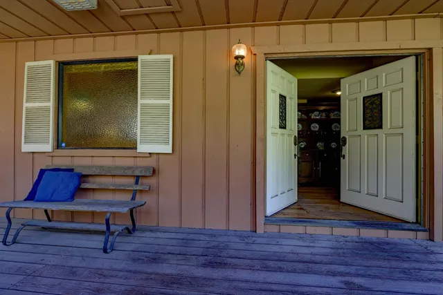 a room with wooden floor and furniture