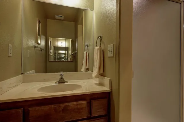 a bathroom with a sink and a mirror