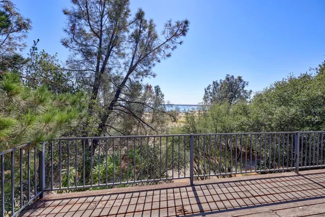 a view of a balcony with a pot