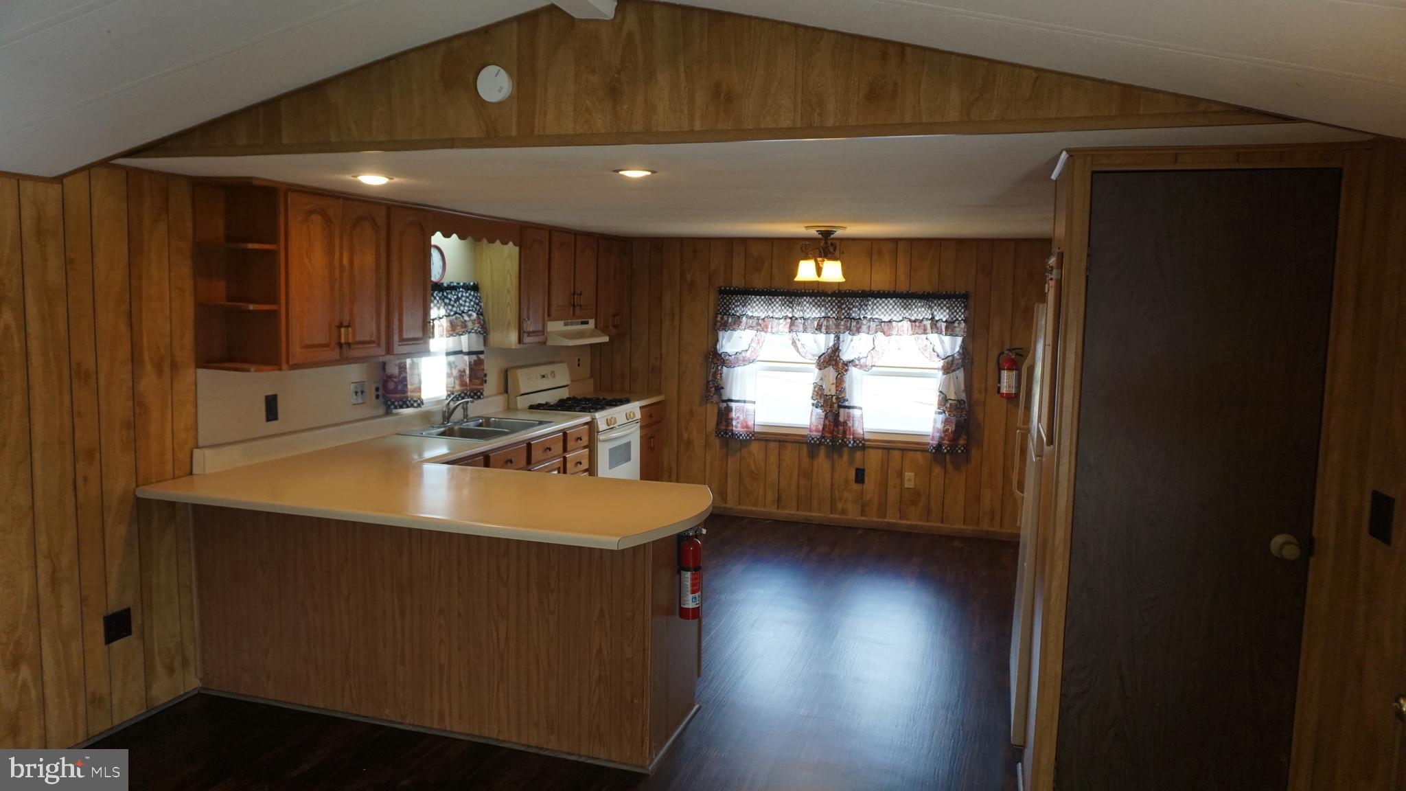 572 Miles Standish Lane Buena, NJ 08310 - Photo 10 of 22 a view of a room with wooden floor and kitchen