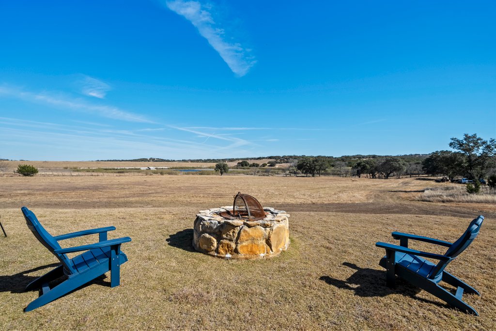 3259 Schumann Road Stonewall, TX 78671 - Photo 29 of 35 a view of a lake with furniture
