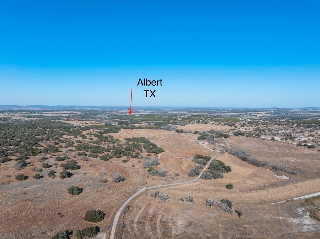 3259 Schumann Road Stonewall, TX 78671 - Photo 35 of 35 a view of a beach with a yard