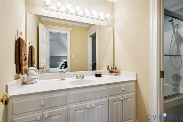 a bathroom with a double vanity sink mirror and