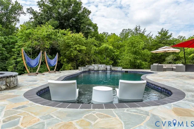 a view of a swimming pool with a patio