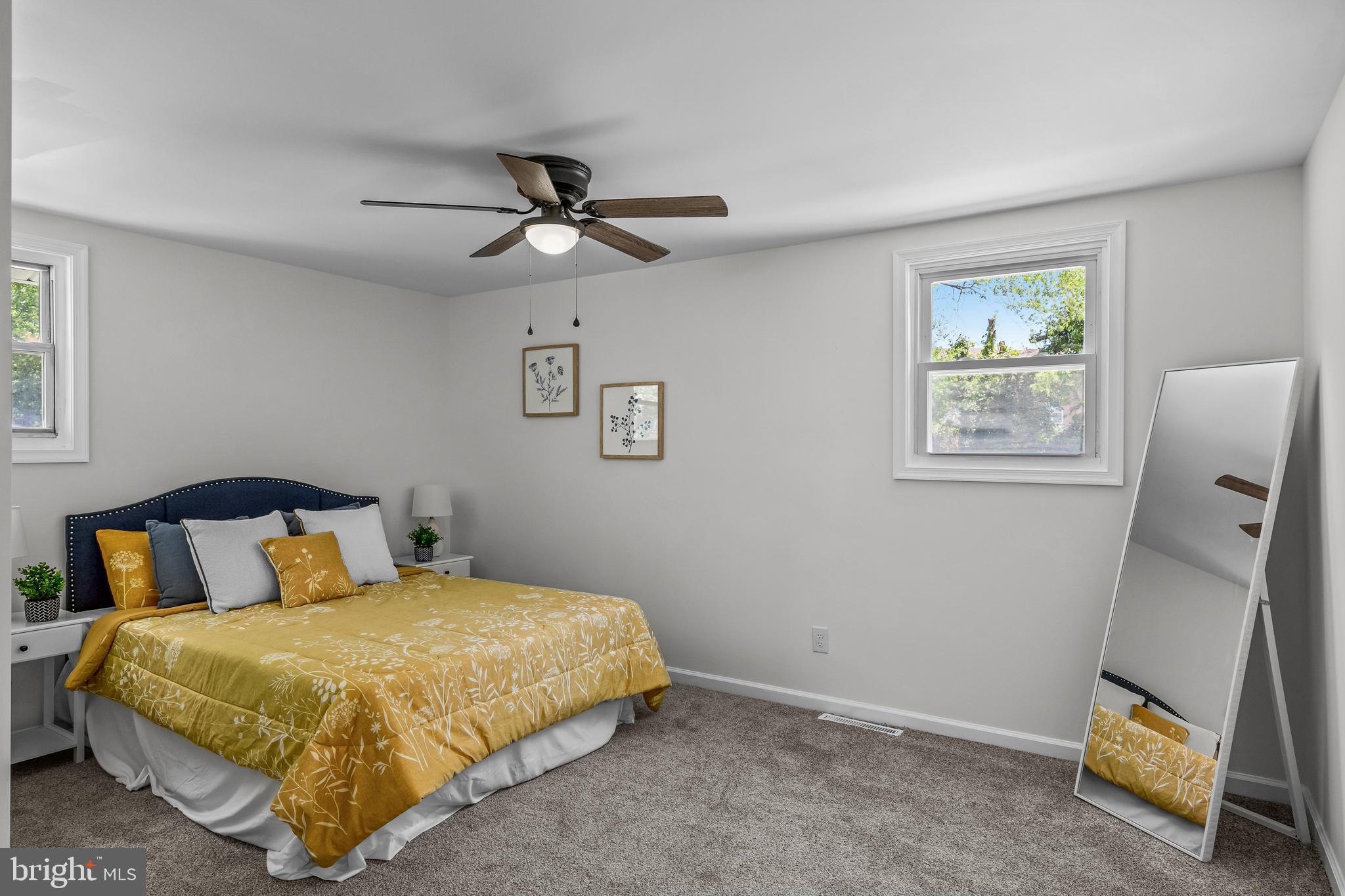 219 Somerset Road Woodbury, NJ 08096 - Photo 10 of 13 a bedroom with a bed and a window