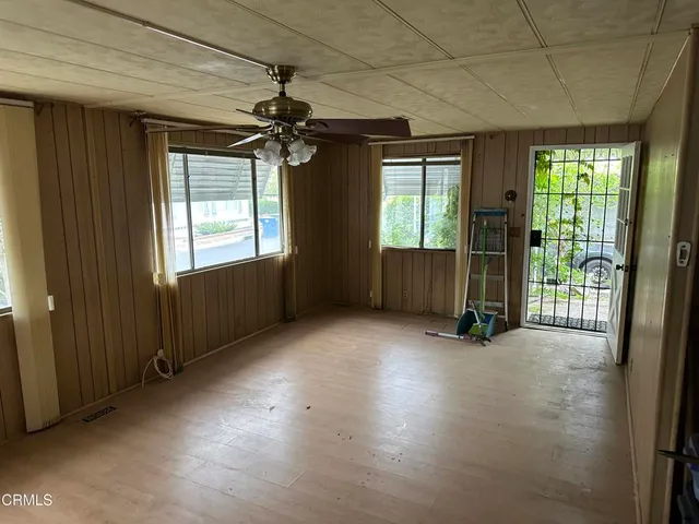 a view of empty room with a fireplace