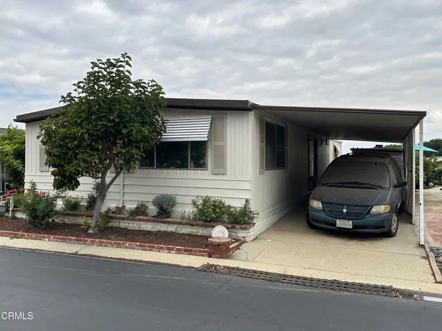 a car parked in front of a house
