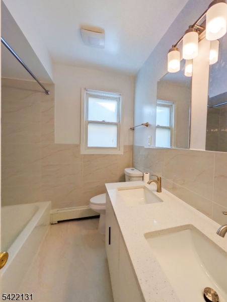 39 Church Street, Unit A Millburn, NJ 07041 - Photo 11 of 14 a bathroom with a sink and a mirror