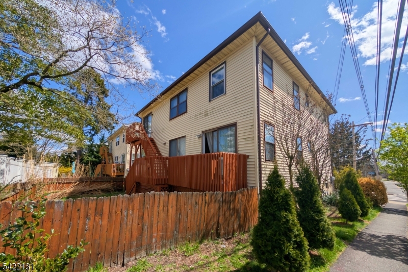 39 Church Street, Unit A Millburn, NJ 07041 - Photo 13 of 14 a view of a house with wooden fence