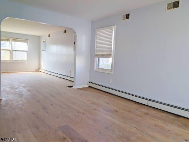 39 Church Street, Unit A Millburn, NJ 07041 - Photo 4 of 14 an empty room with windows