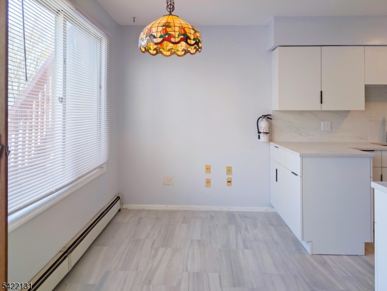 39 Church Street, Unit A Millburn, NJ 07041 - Photo 6 of 14 an empty room with a window