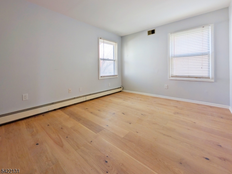 39 Church Street, Unit A Millburn, NJ 07041 - Photo 8 of 14 an empty room with a window