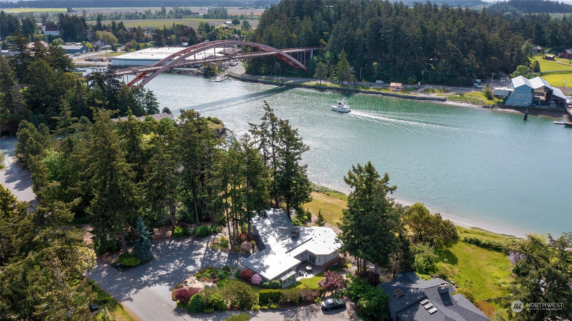 97 Samish Place La Conner, WA 98257 - Photo 1 of 40 a view of a lake with houses