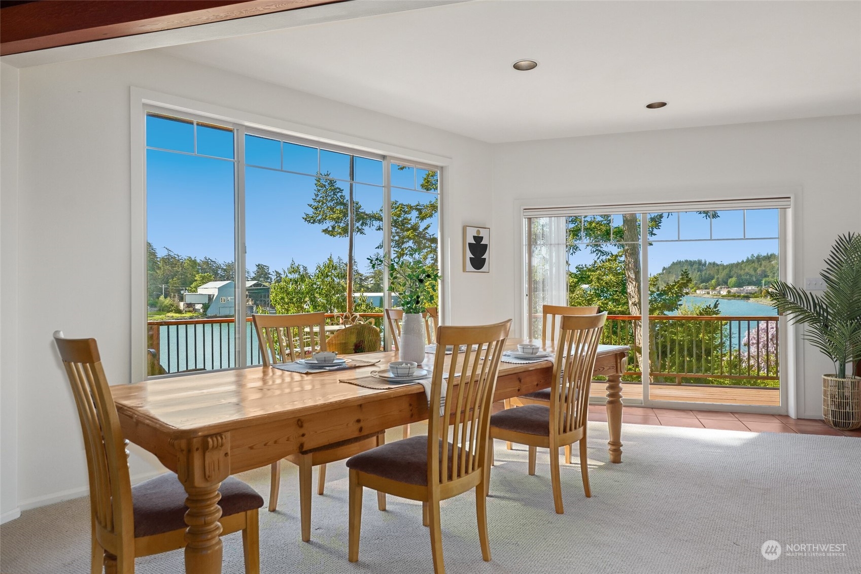 97 Samish Place La Conner, WA 98257 - Photo 11 of 40 a view of a dining room with furniture window and outside view