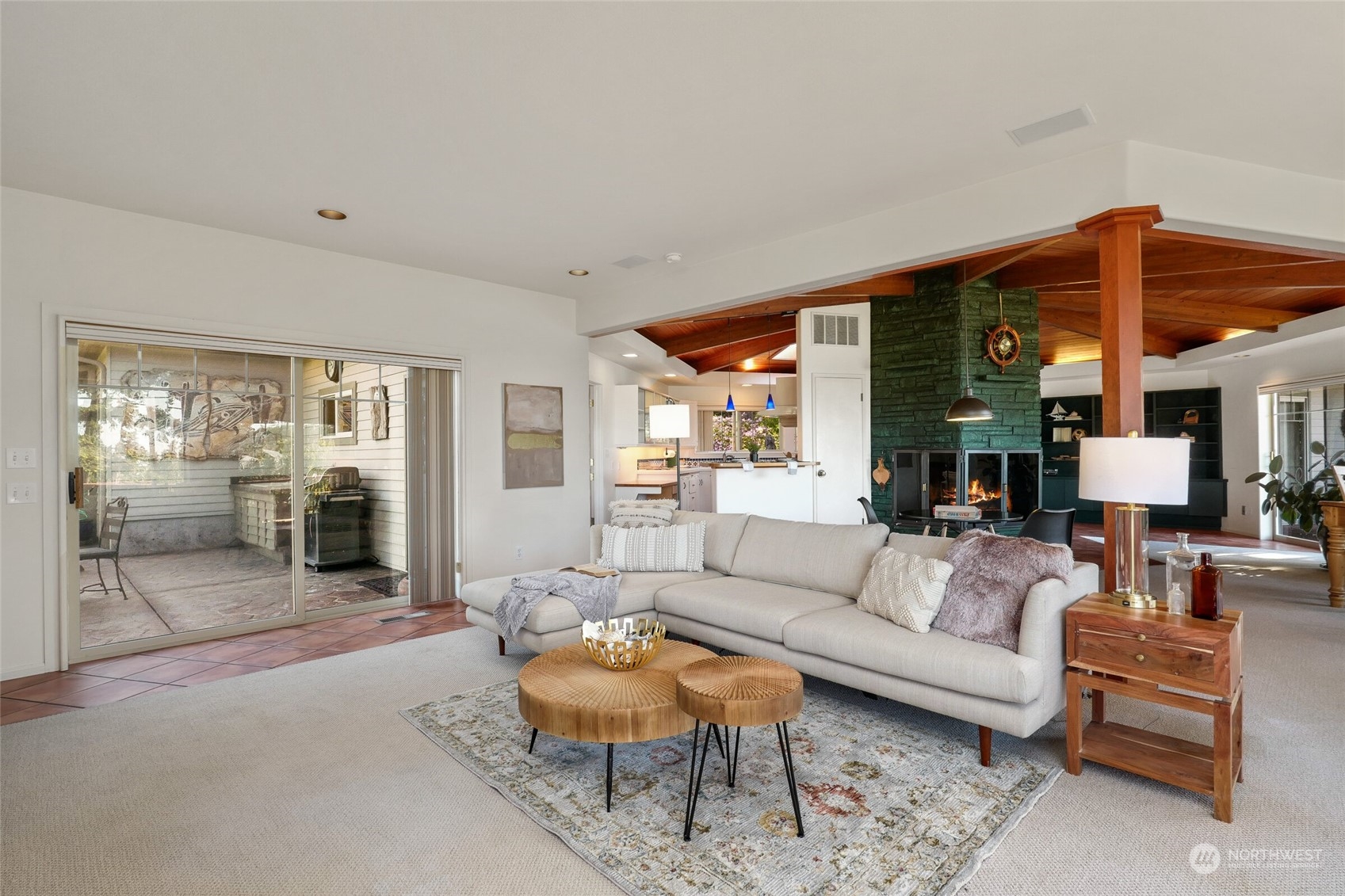 97 Samish Place La Conner, WA 98257 - Photo 16 of 40 a living room with furniture a wooden floor and a large window