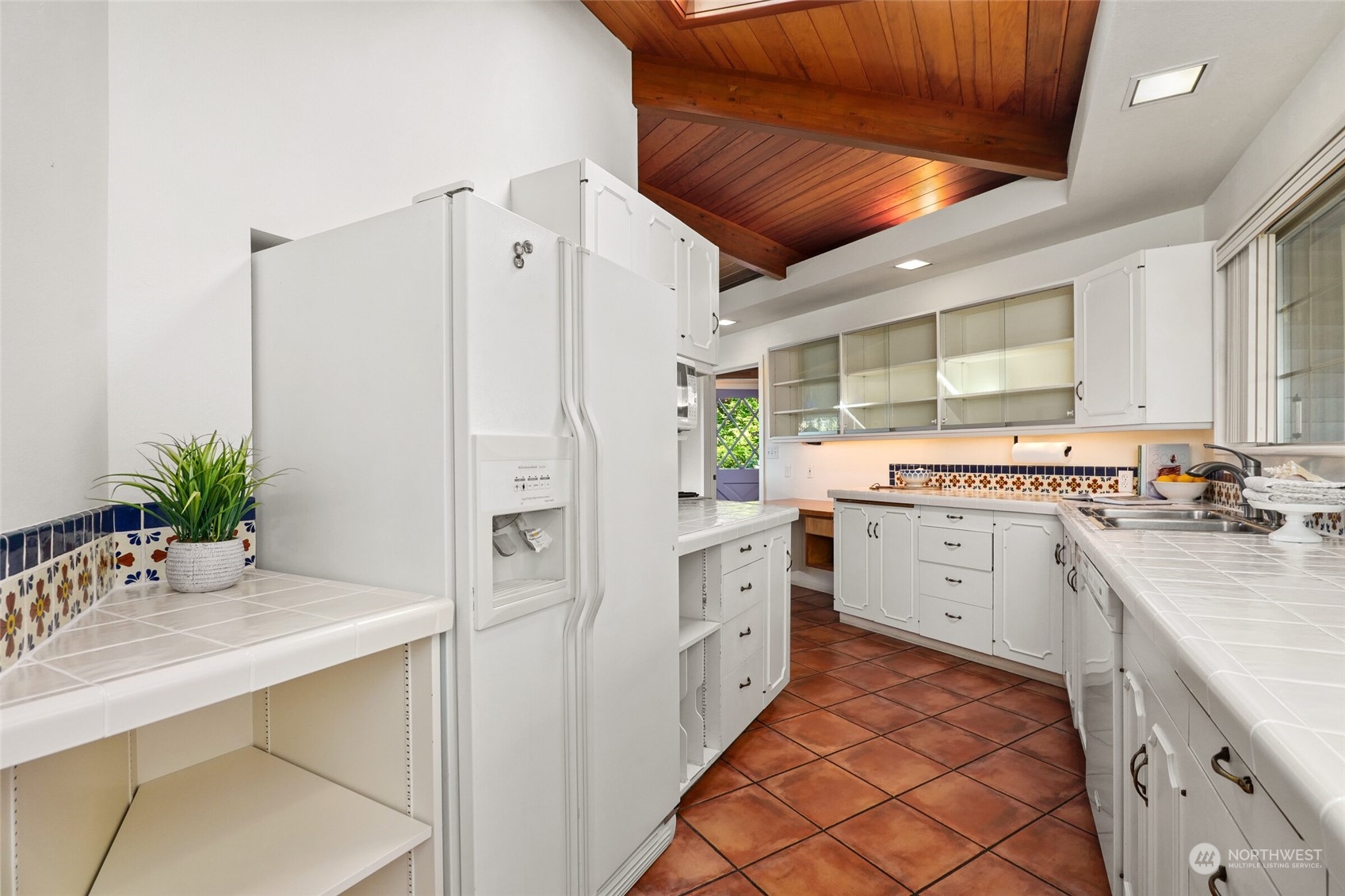 97 Samish Place La Conner, WA 98257 - Photo 19 of 40 a kitchen with a refrigerator and a sink