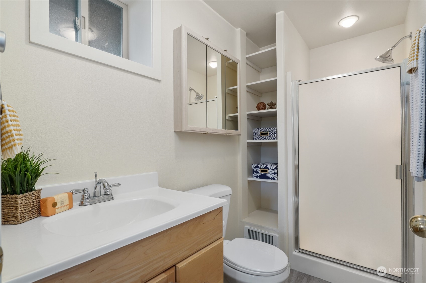 97 Samish Place La Conner, WA 98257 - Photo 29 of 40 a bathroom with a sink a toilet and shower