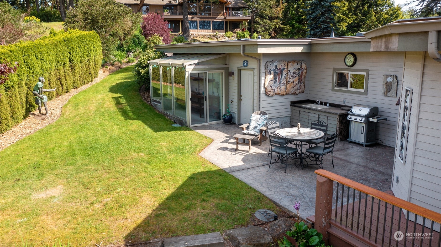 97 Samish Place La Conner, WA 98257 - Photo 31 of 40 a view of a chair and tables back yard of the house