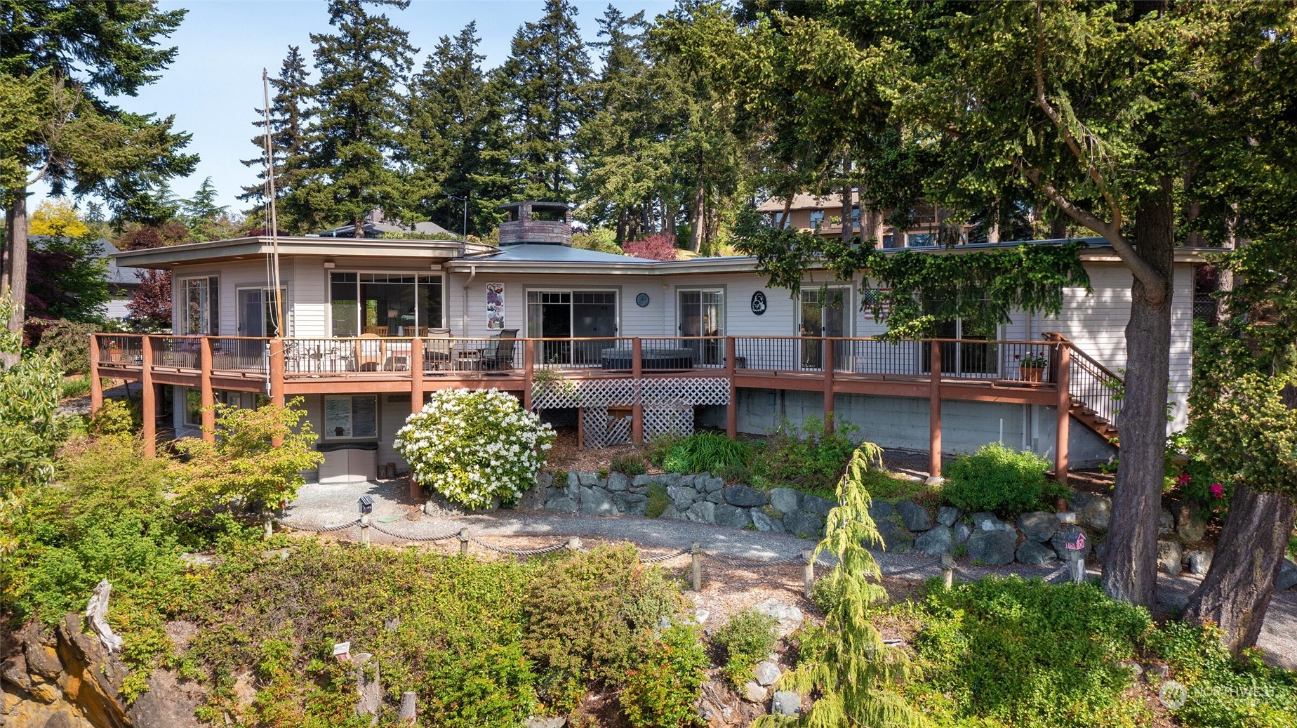 97 Samish Place La Conner, WA 98257 - Photo 35 of 40 a front view of a house with a yard table and chairs