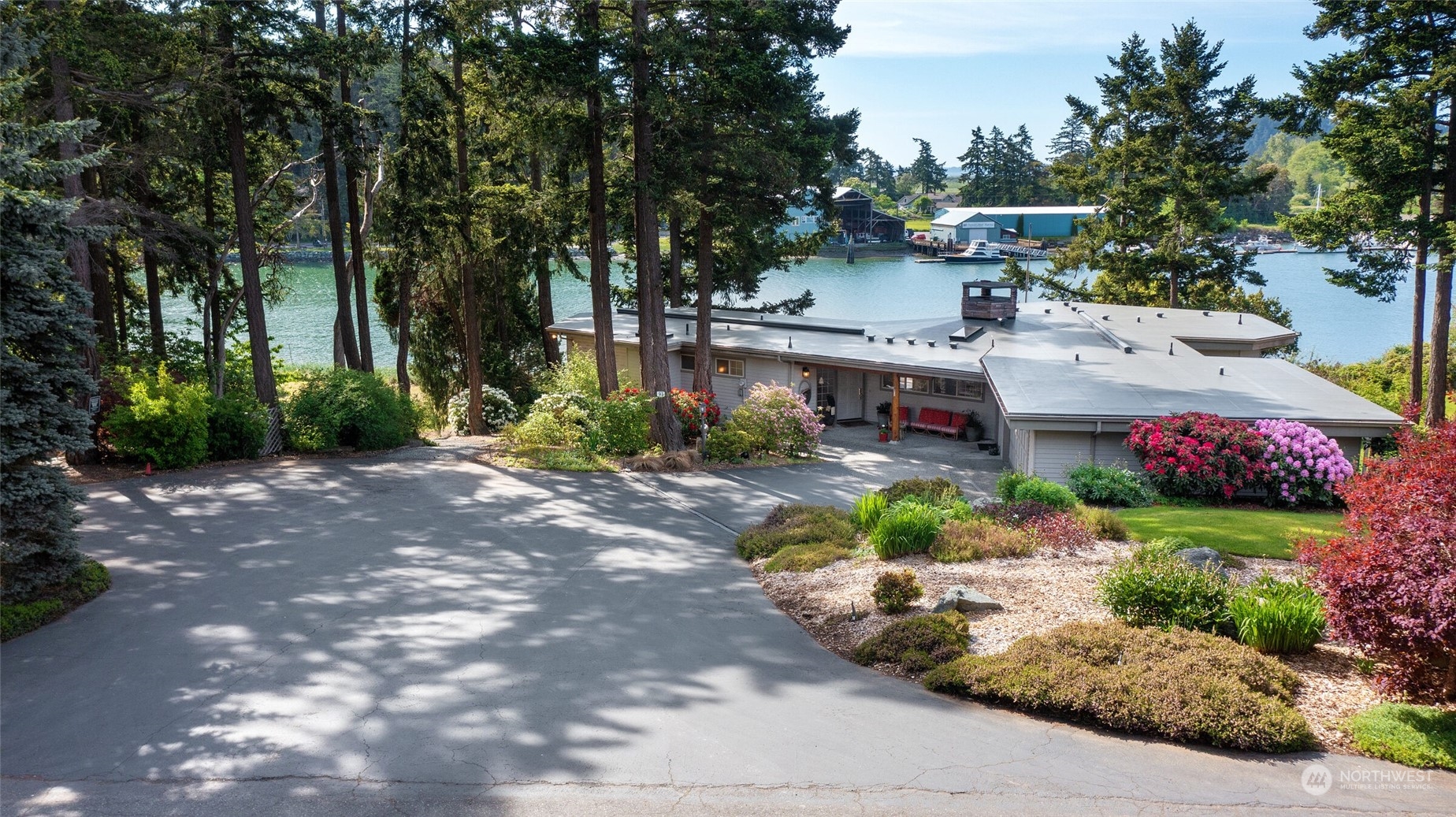97 Samish Place La Conner, WA 98257 - Photo 5 of 40 a view of street with small plants and trees