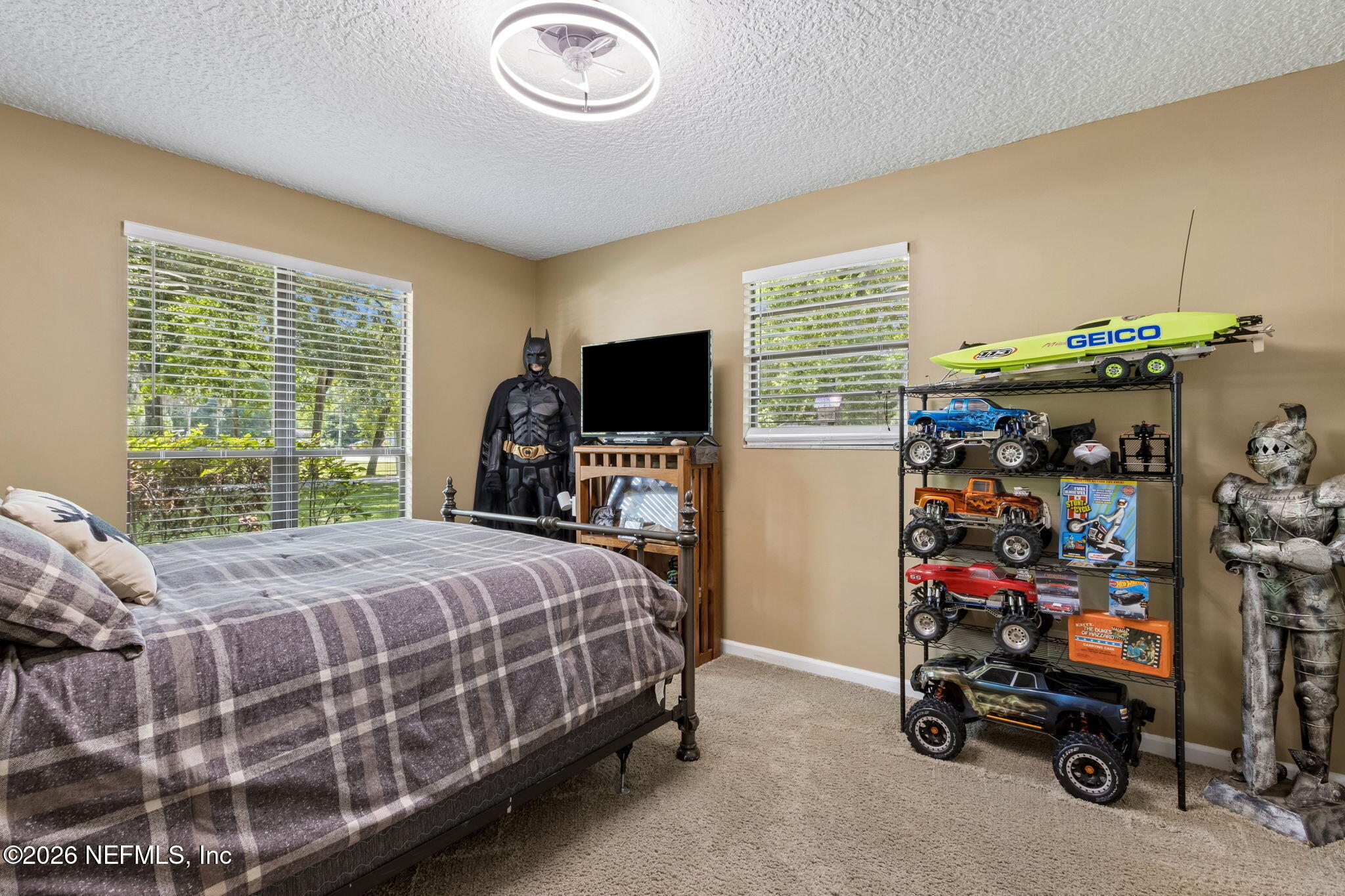 3194 Creighton Landing Road Fleming Island, FL 32003 - Photo 23 of 31 a bedroom with a bed and a tv