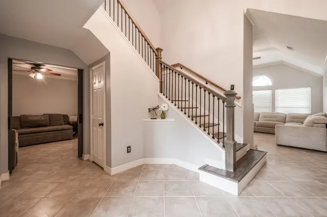 a view of a hallway with entryway door