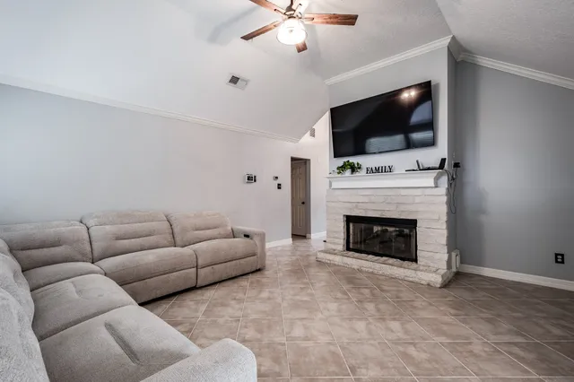a kitchen with a table chairs and white cabinets