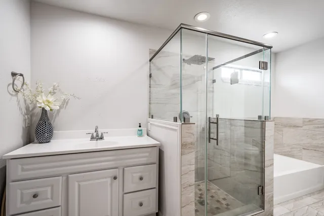 a bathroom with a bathtub and a shower