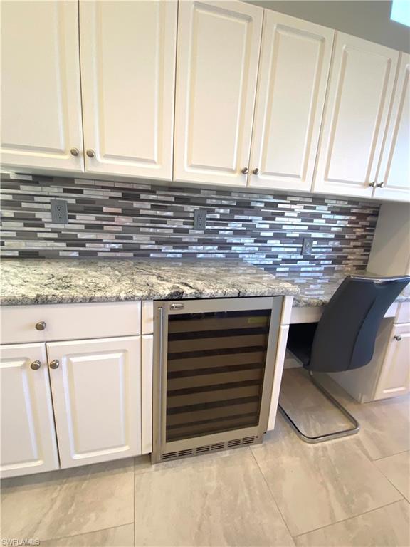 19307 Silver Oak Drive Estero, FL 33967 - Photo 12 of 43 a kitchen with granite countertop a stove and a sink