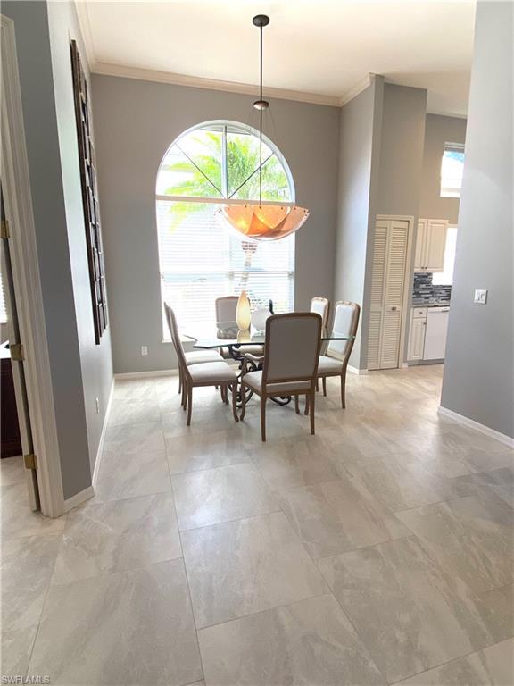 19307 Silver Oak Drive Estero, FL 33967 - Photo 13 of 43 a view of a dining room with furniture window and outside view