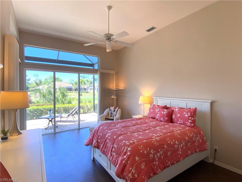 19307 Silver Oak Drive Estero, FL 33967 - Photo 14 of 43 a bedroom with a large bed and a large window